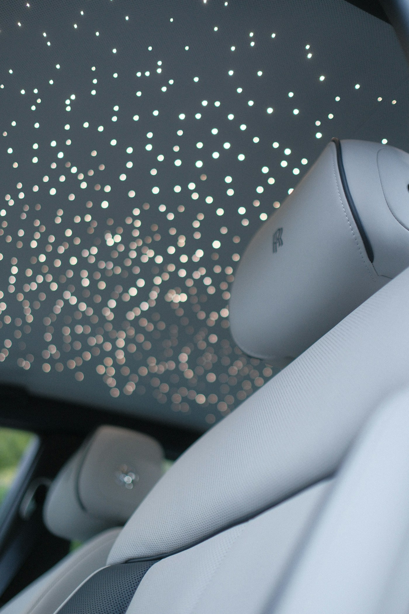 Lit starlight headliner inside a car